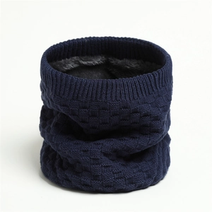 Detailed view of dark blue checkered knit neck warmer with soft grey fleece lining