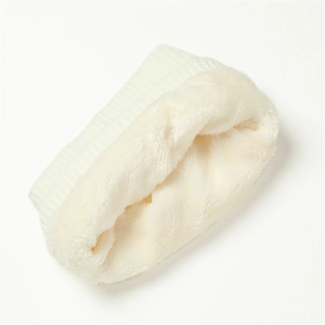 Detailed macro view of white thermal knit scarf with thick soft plush fleece lining