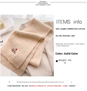 Detailed view of beige knit scarf texture with exquisite cartoon dachshund embroidery