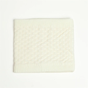 Close-up of cream white knit neck warmer with checkerboard texture and ribbed edges
