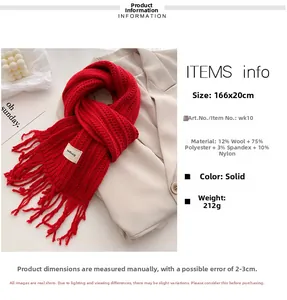 Detail of red cable knit wool scarf showing material specs, fringe and soft texture