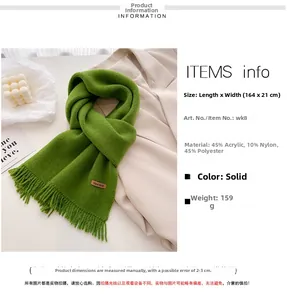 Detail view of green knitted scarf with handmade label and fringe, size 164x21cm