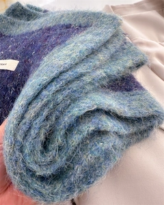 Close-up of blue and purple gradient mohair knit scarf showing fluffy texture and soft fibers