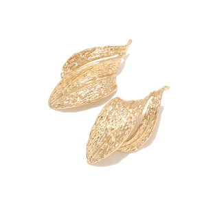Retro hollow geometric textured gold earrings with irregular metallic leaf design