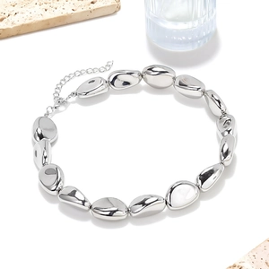 Minimalist silver irregular bead necklace with polished metallic finish and lobster clasp