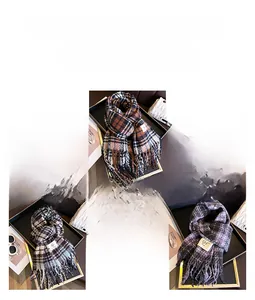 Detailed view of plaid scarves with fringe in warm brown, gray, and purple tones