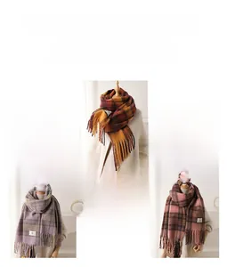 Detail of warm checkered knit scarves with tassels in various autumn color patterns