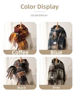 Detail view of plaid cashmere scarf in coffee, blue, black, and grey with fringe edges