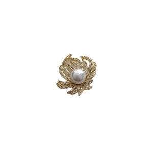 Elegant gold plated lapel pin featuring a large white pearl surrounded by zircon petals