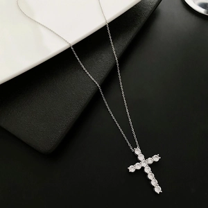 Elegant silver cross pendant necklace with sparkling cubic zirconia stones on O-chain
