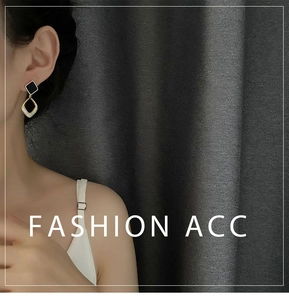 Close-up of elegant square earrings with cubic zirconia charms worn by a model