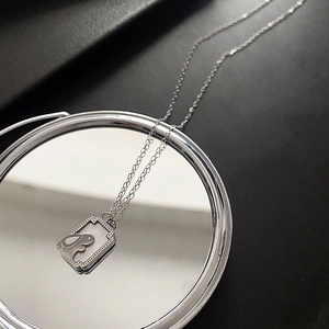 Silver titanium steel necklace featuring a moon rabbit white shell square pendant on a mirror
