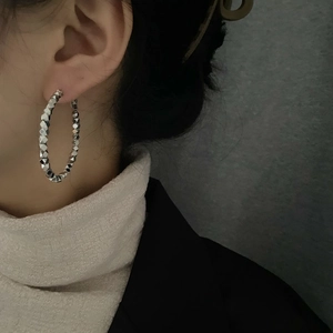 Silver geometric textured hoop earrings for women with a unique multifaceted design