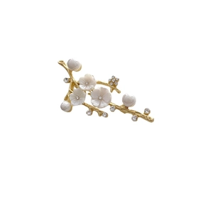 Elegant gold flower branch brooch with natural shell petals and sparkling crystals