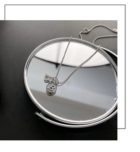 Close-up of titanium steel ball chain necklace with 3D B letter and round logo pendant