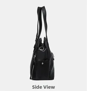 Side view of black pebble leather tote bag showing zipper pocket and magnetic snap button