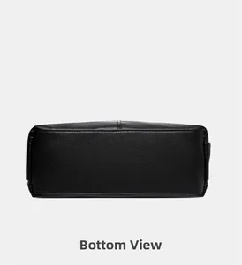 Detailed bottom view of black pebble leather tote bag showing neat stitching and texture
