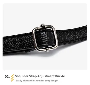 Macro detail of black pebble leather shoulder strap with silver adjustable metal buckle