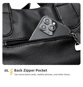 Detail of a black pebbled leather tote bag featuring a practical rear zipper pocket