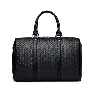 Große schwarze Reisetasche aus geflochtenem Leder mit Doppelgriffen und Silberbeschlägen