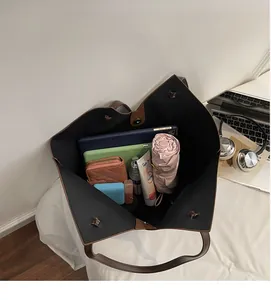 Top view of spacious tote bag interior showing capacity for laptop and daily essentials
