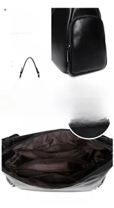Detailed interior of black leather shoulder bag with multiple storage compartments