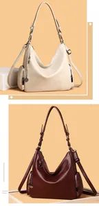 Detail of hobo shoulder bag featuring litchi texture and spaghetti strap design