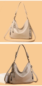 Close-up of hobo bag featuring pebbled leather texture and adjustable wide shoulder straps