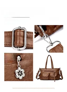 Détail du sac à bandoulière en cuir marron avec fermeture éclair à motif floral
