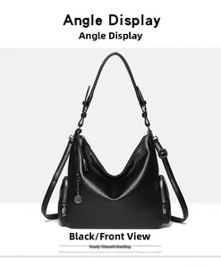 Close-up of black lychee leather bag featuring gunmetal hardware and side zipper detail