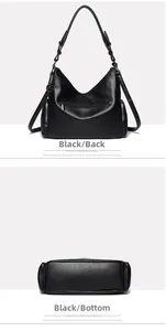 Detail view of black lychee leather bag showing back zipper pocket and flat bottom base