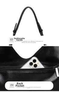 Detail view of black lychee leather bag featuring a smooth handle and back zipper pocket