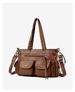 Gros plan d'un sac cabas marron foncé à poches multiples en cuir PU vintage