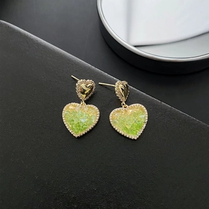 Elegant heart drop earrings with green crystal stones and gold textured frames