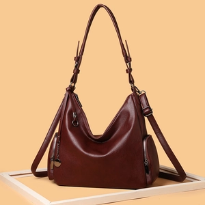Vintage wine red leather hobo bag with adjustable straps and side zipper detail
