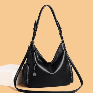Classic black litchi pattern leather hobo bag with adjustable strap and metal charm