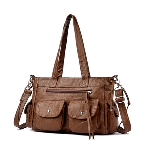 Sac fourre-tout vintage marron avec plusieurs poches et finitions en métal argenté
