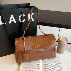 Retro brown large capacity shoulder bag with gold twist lock and vintage leather texture