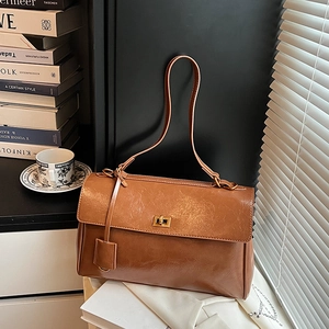 Retro caramel brown large capacity shoulder bag with gold metal twist lock and matte leather