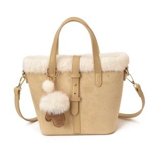 Khaki suede handbag with white faux fur trim and detachable strap for winter
