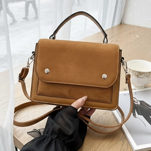Two-tone brown faux leather and suede handbag with silver buckles and top handle