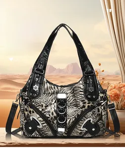 Detail of leopard print shoulder bag with decorative studs and floral charm accent