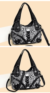 Detail of bohemian animal print tote bag with silver zippers and floral pendants