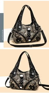 Detail view of leopard print washed leather bag with silver zippers and floral charms