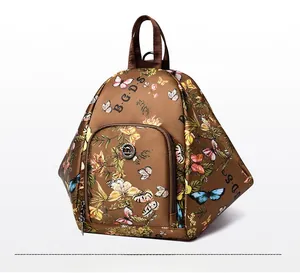 Side view of dark brown backpack with colorful floral and butterfly patterns