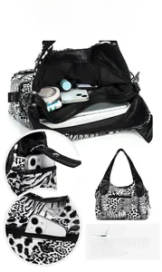 Detail view of large leopard zebra print bag showing spacious inner compartments and pockets