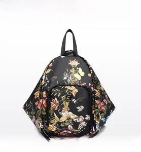 Front view of black floral backpack with vibrant butterfly prints and silver zippers