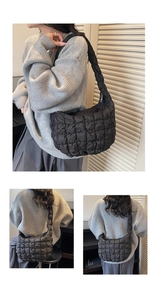Détail du sac nuage noir matelassé montrant la texture moelleuse et la bandoulière intégrée