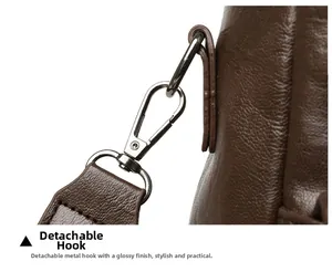 Detail of gunmetal lobster claw hook on brown pebbled leather travel backpack