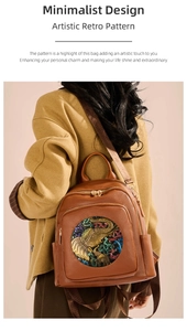Detail of brown lychee grain leather backpack featuring vintage elephant art and gold zippers